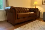 Chesterfield Sofa Brown shown in a realistic home living room setting