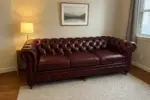 Chesterfield Sofa Burgundy shown in a realistic home living room setting