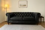 Chesterfield Sofa Loveseat Black shown in a realistic home living room setting